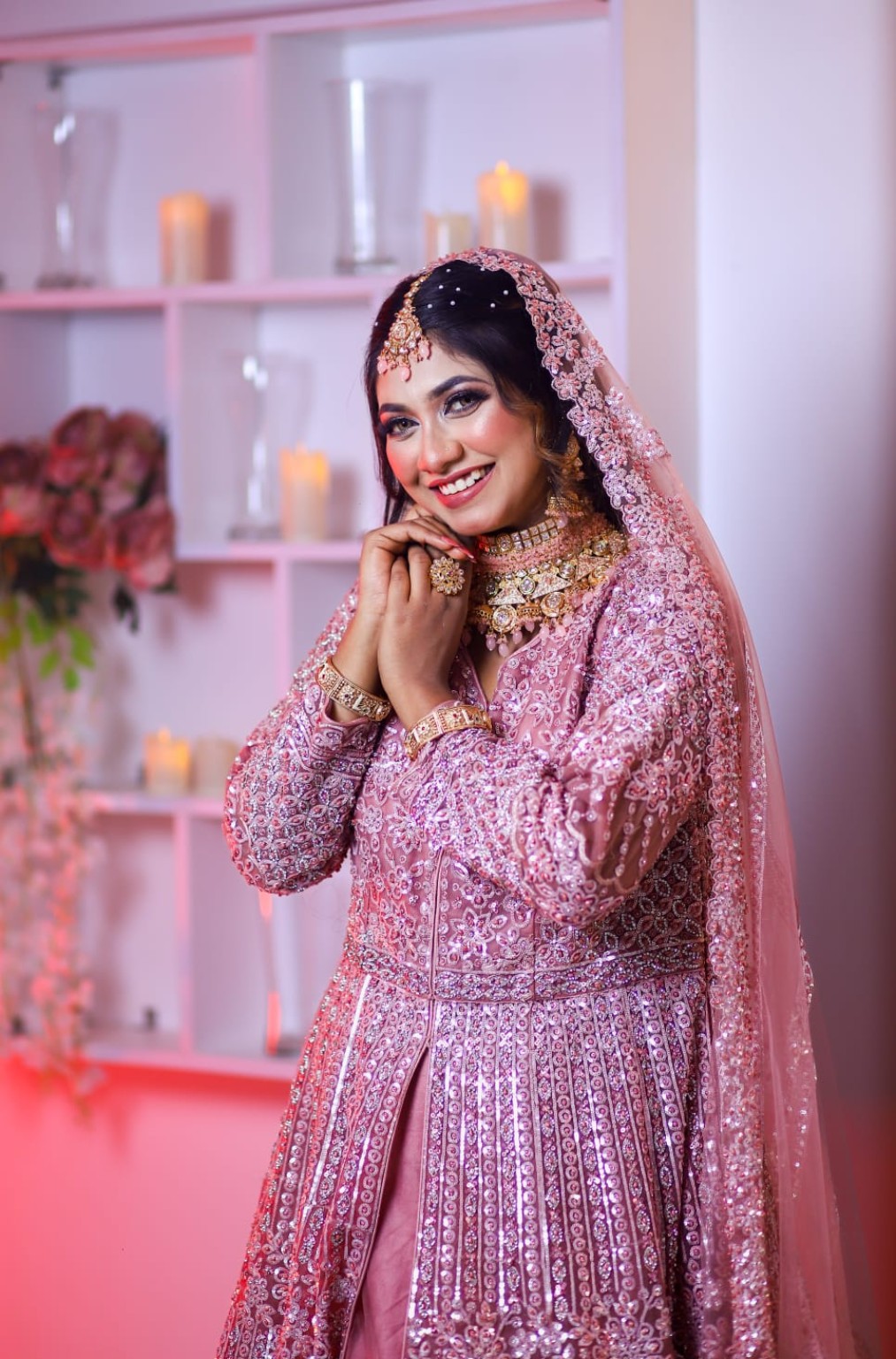 Bride in pink wedding outfit